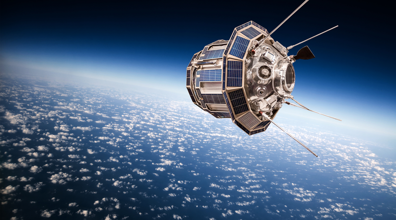 Communications satellite orbiting above earth