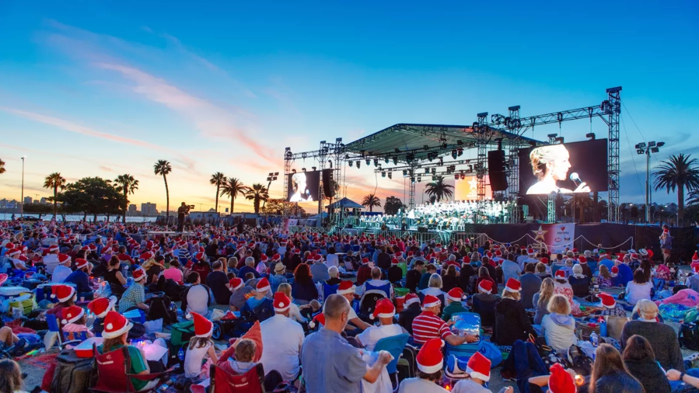 A crowd enjoying Christmas Carols at Langley Park