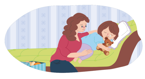 A parent sitting beside a child who is crying while lying on a bed holding a teddy bear.