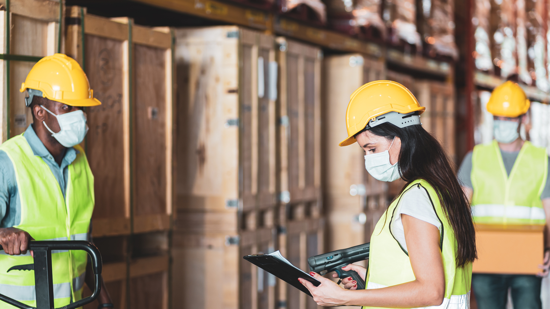 Diversity workers wear protective face mask in warehouse