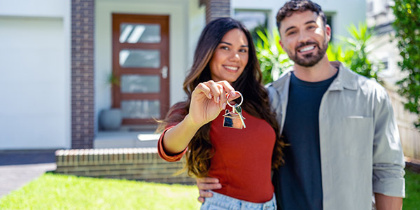 couple showing off new house keys