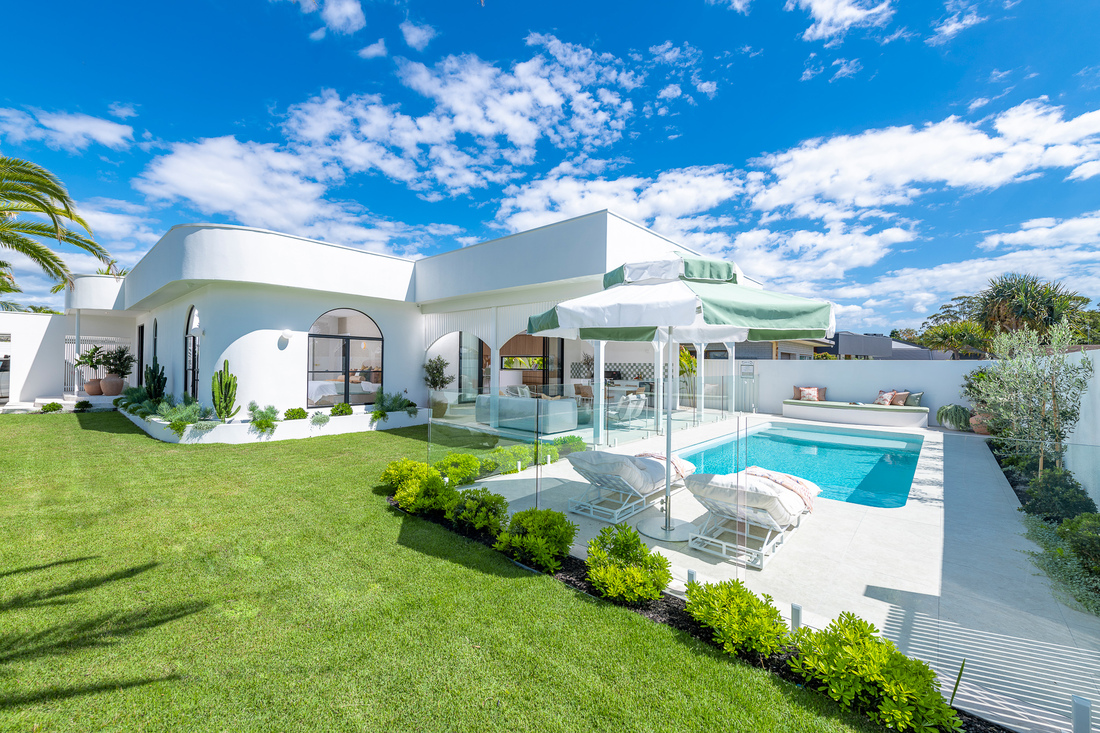 A single level home with an alfresco area and a pool.