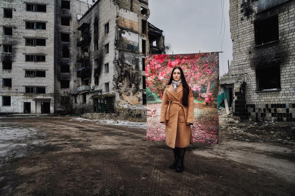 woman in burnt buildings