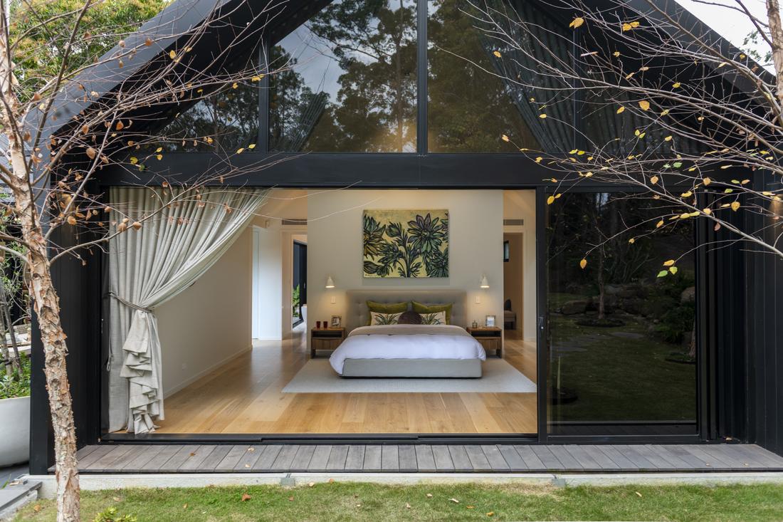 A large sliding door leading to the master bedroom