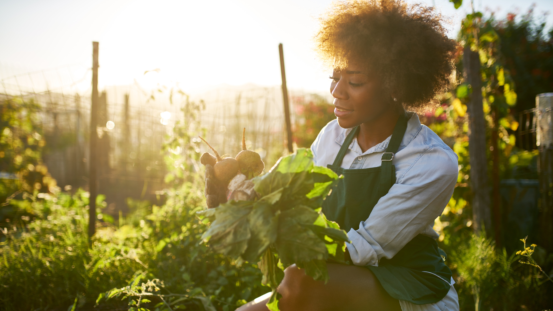 african american woman in community garden