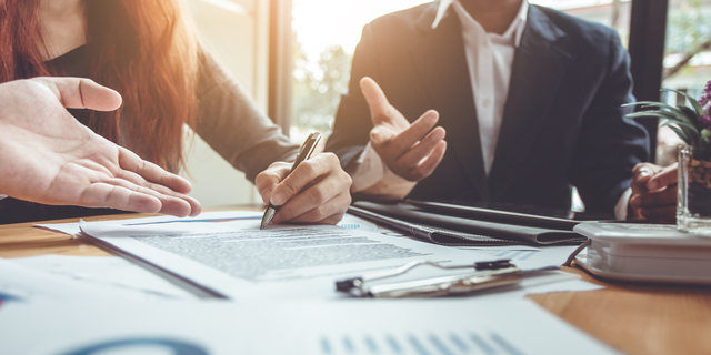 Business Signing a Contract Buy - sell house.