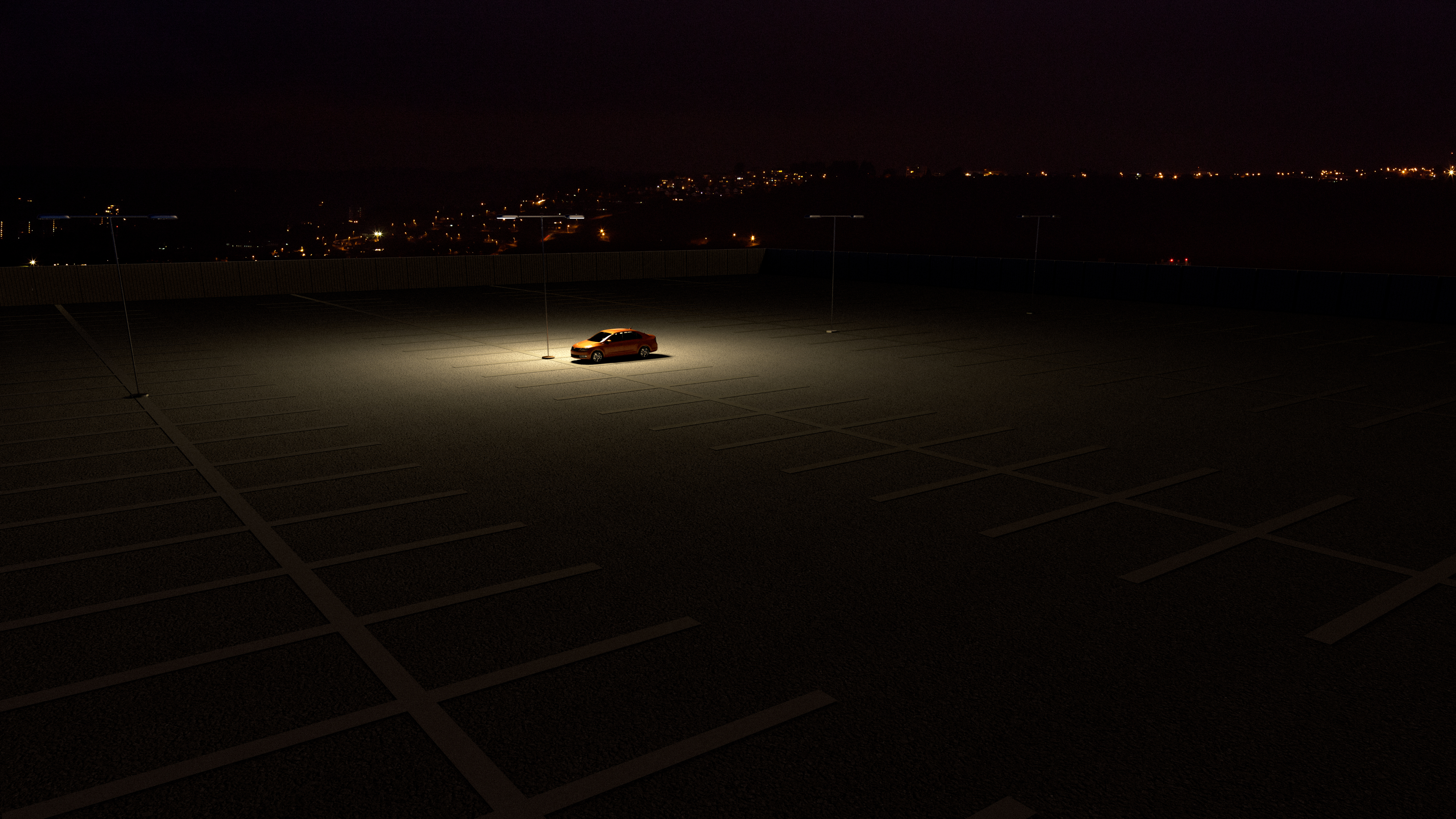 A single orange car is parked under a streetlamp in an otherwise empty and dark parking lot at night. The surrounding area is dimly lit, with only the car illuminated by the overhead light. In the distance, the lights of a city or town can be seen glowing faintly on the horizon. The scene feels quiet and isolated.