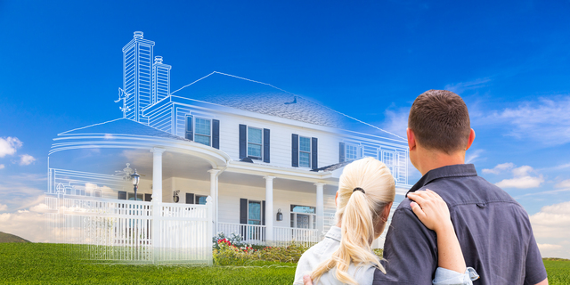 Couple Facing Ghosted House Drawing and Photo Over Green Landscape