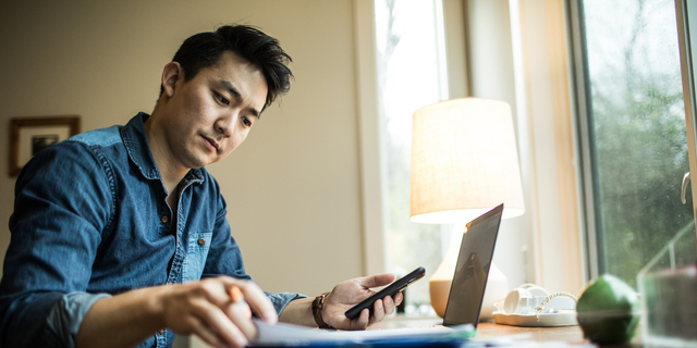 Man (early 30s) working in home office