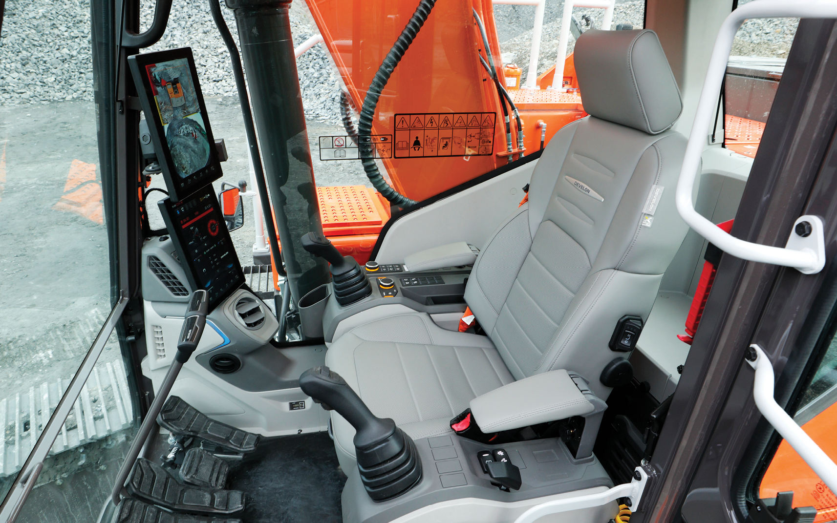 An air-suspension seat in a DEVELON excavator cab.