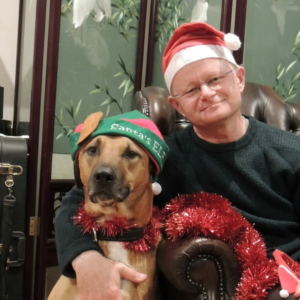 Dr Mark Schipp and dog Clay - Christmas 2021-sq.jpg