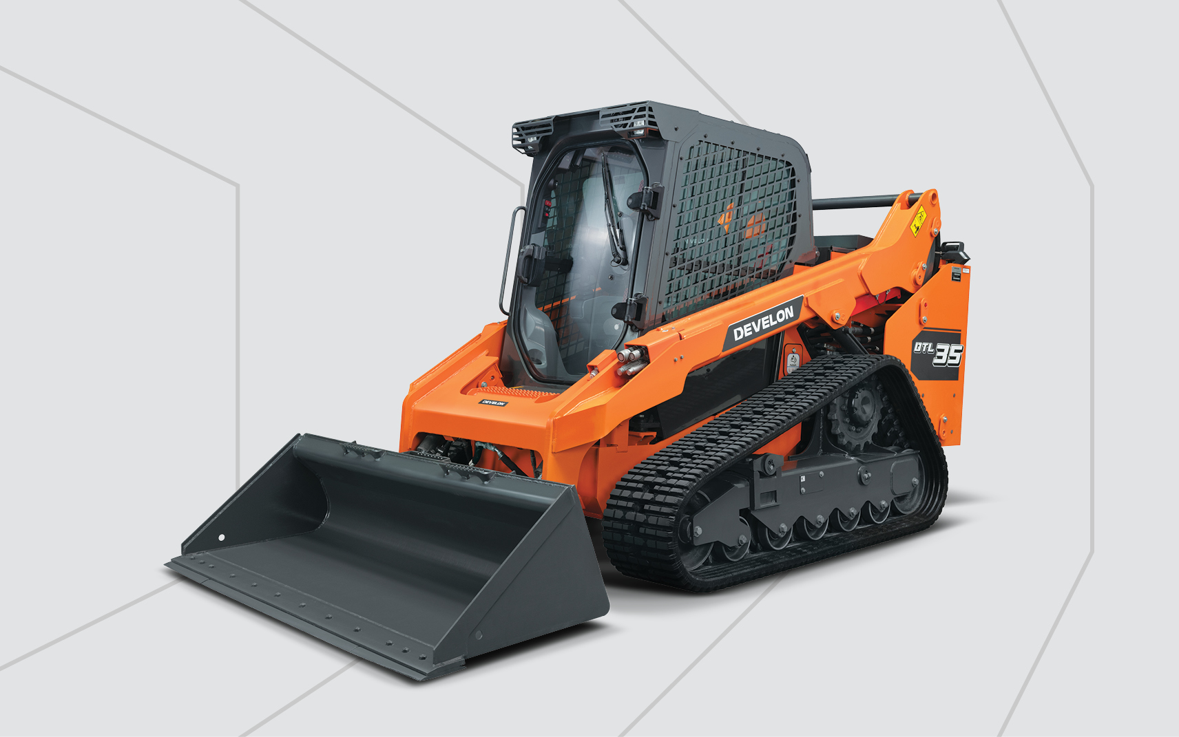 A DEVELON DTL35 Compact Track Loader in front of a grey background