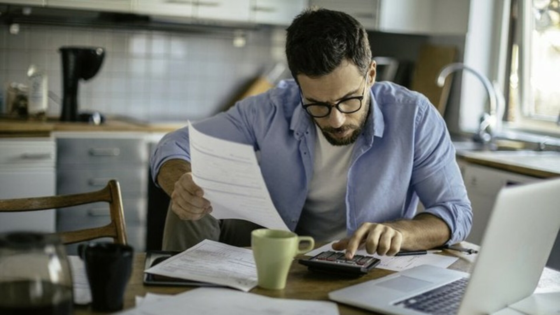 man at laptop with coffee mug.jpg