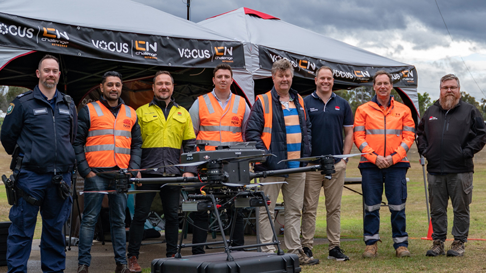 Picture of Vocus and Challenge Networks team with drone