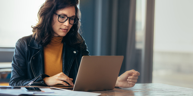 Asian woman working laptop at office