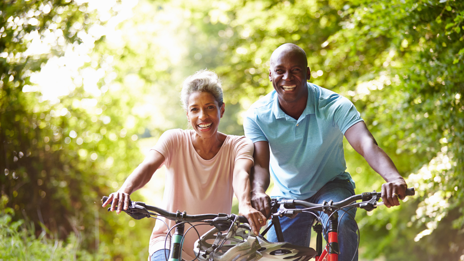 Mature African American Couple On Cycle Ride In Countryside