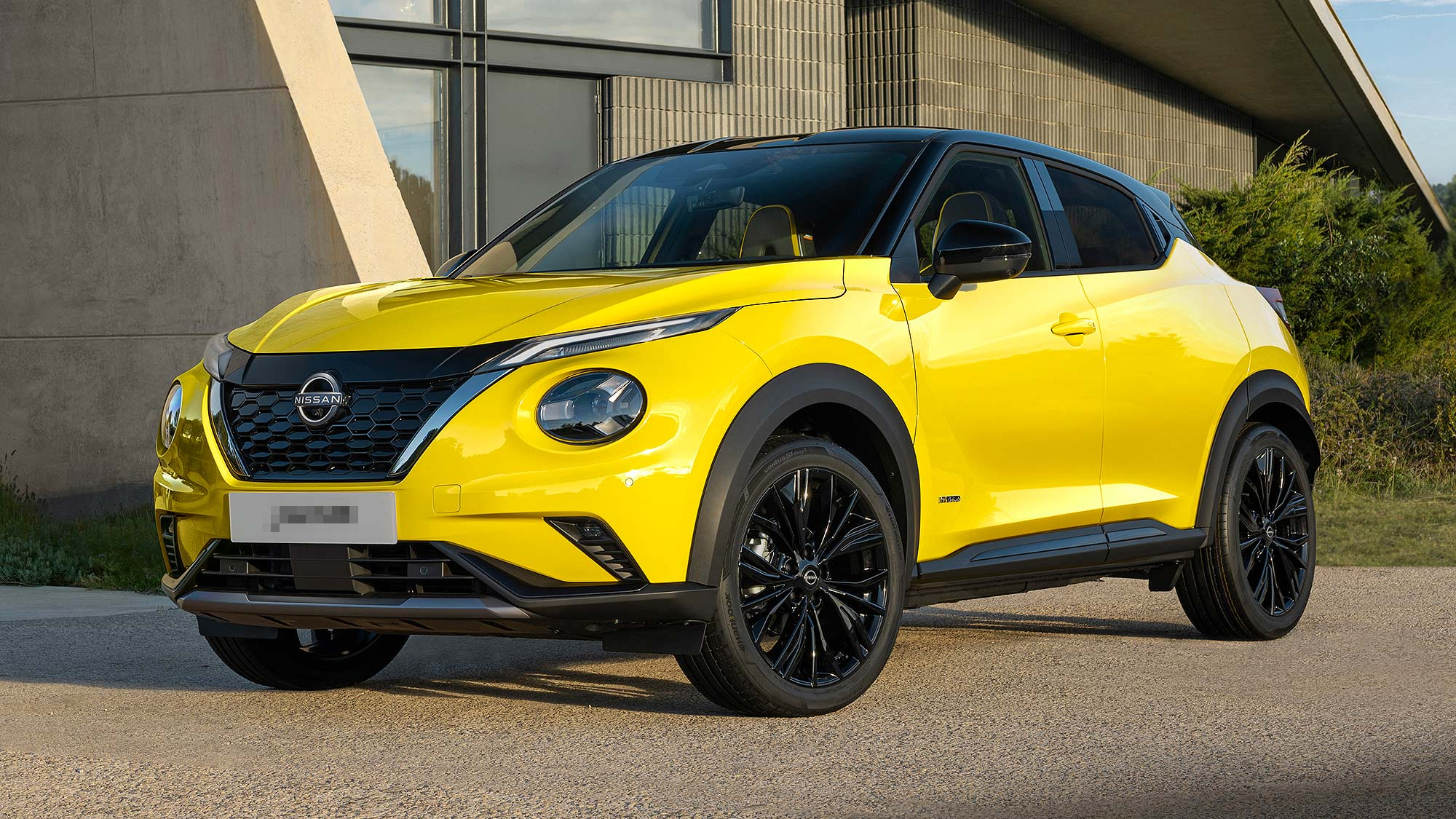 Nissan Juke in bold yellow, hybrid model. A popular Motability Scheme SUV