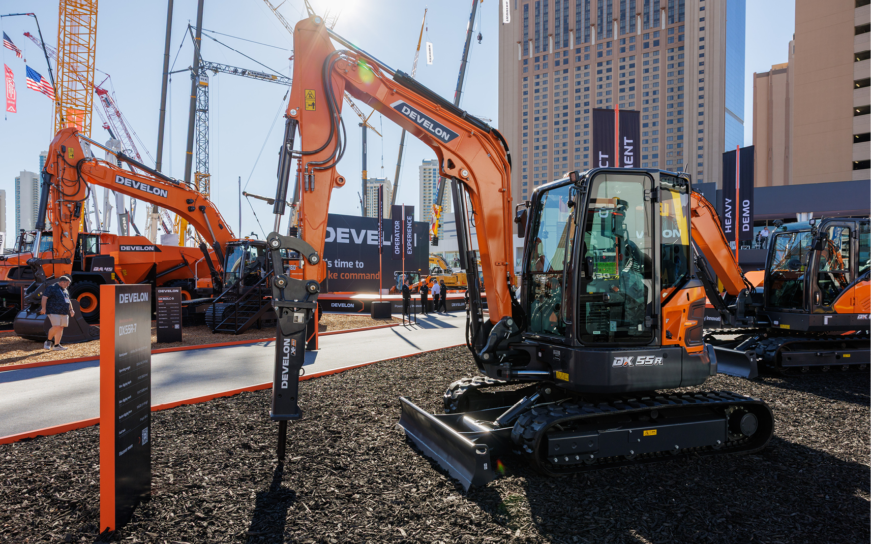 The DX55R-7 mini excavator with breaker attachment on display at the DEVELON booth at CONEXPO 2026.