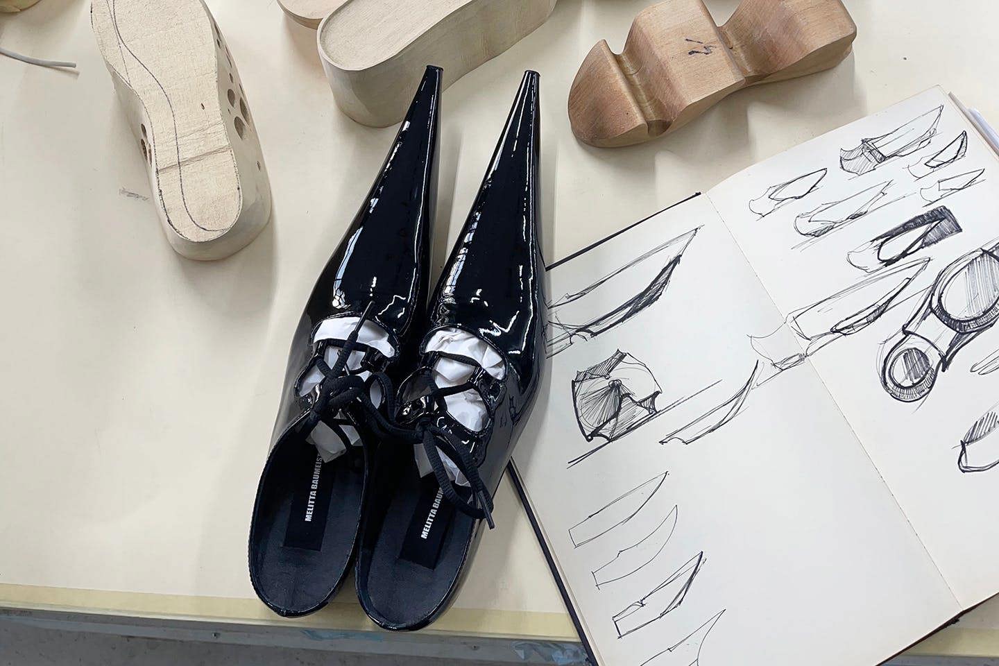 Shoes, shoe prototypes, and sketches by Plata and Baumeister.
