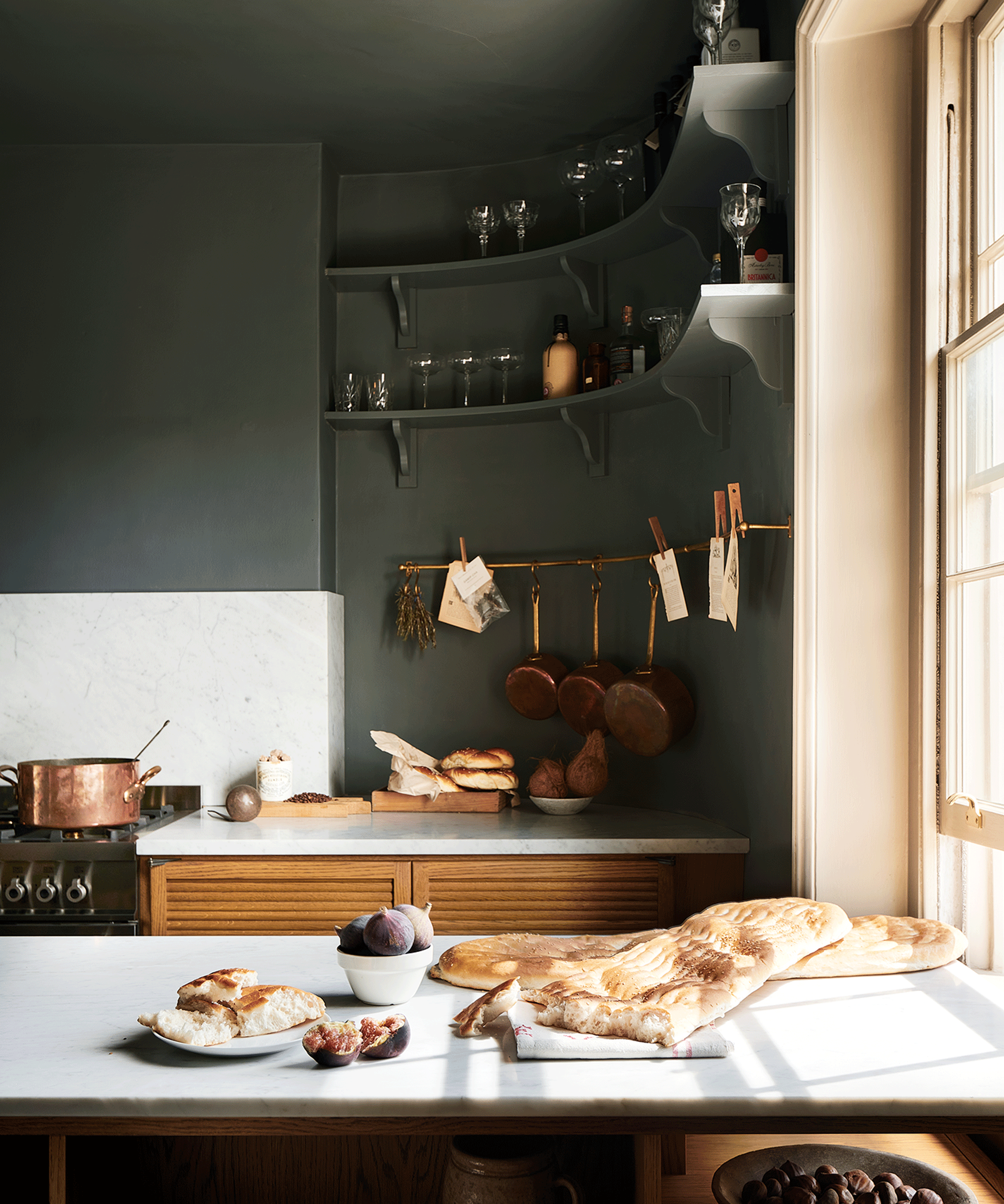 kitchen with dark walls and curved open shelving