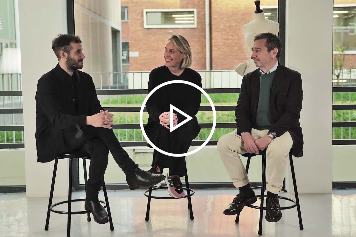 Marco Pecorari, Laurent Cotta, and Miren Arzalluz Sitting on Stools
