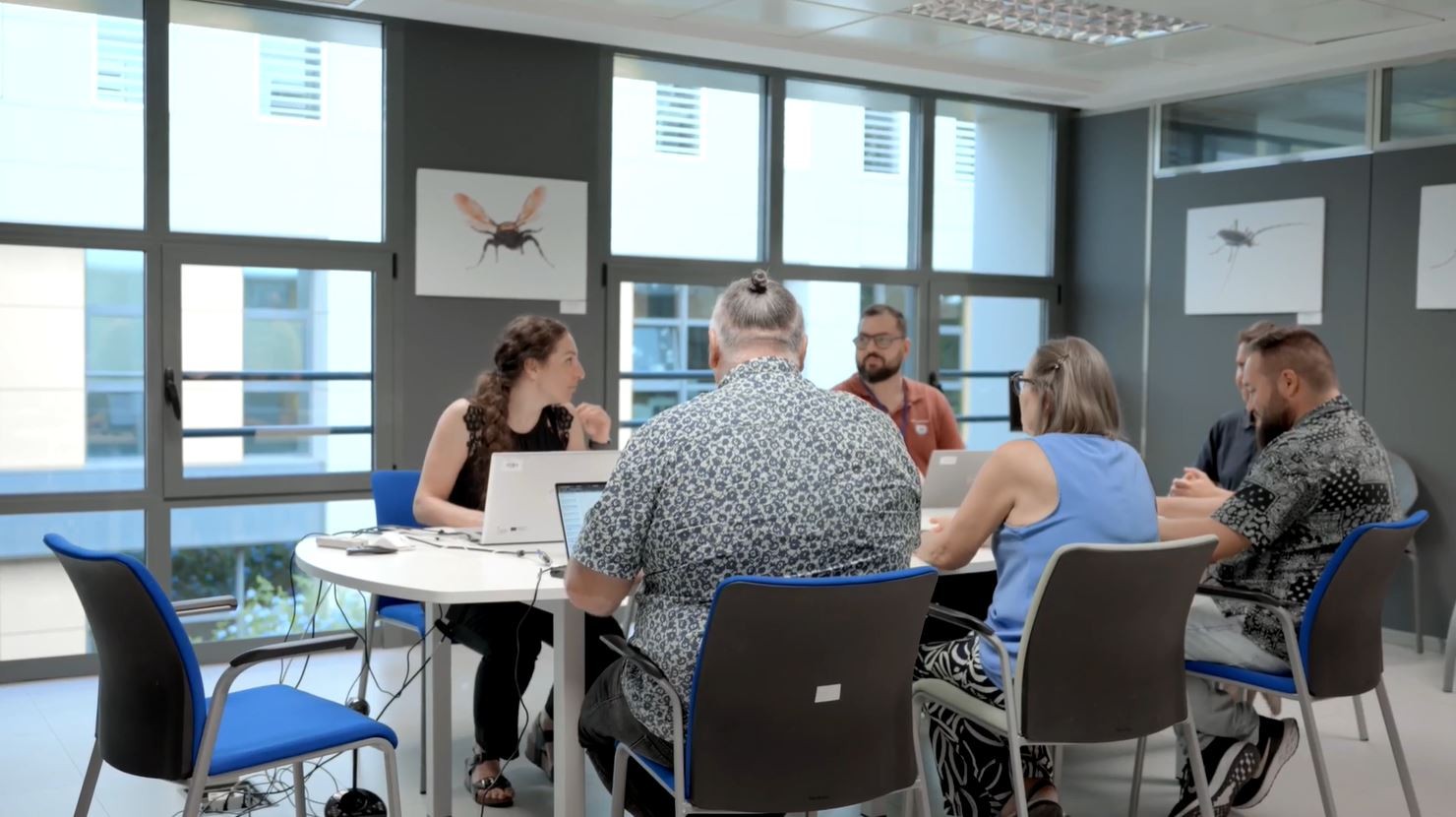 This image showcases the collaborative team effort between GE HealthCare and IB-Salut in digitising healthcare practices across the Balearic Islands. The diverse team of professionals is engaged in discussions, highlighting their commitment to improving patient care through innovative technology solutions.