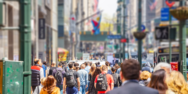 New York, streets. High buildings and crowd walking