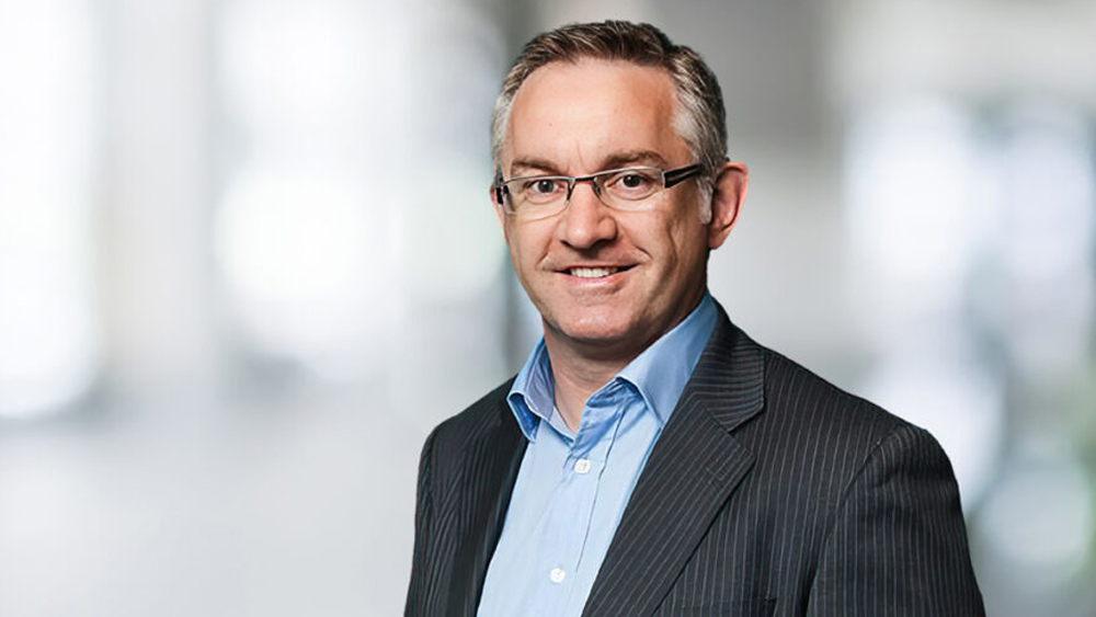 Photo profile of Keith Masterson, Chief Executive, Commander