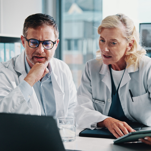 People, doctors and meeting on laptop at hospital for x ray study, laboratory results and collaboration. Staff, tablet and online information for radiology, problem solving and medical report of scan