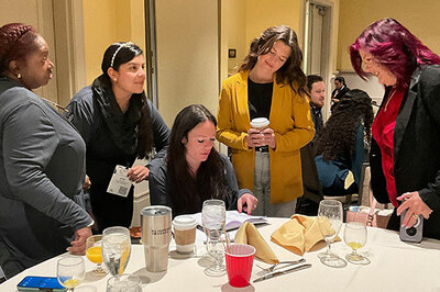 Group of women gathered to discuss all things BICSI and ICT, a representation of a Women in BICSI event