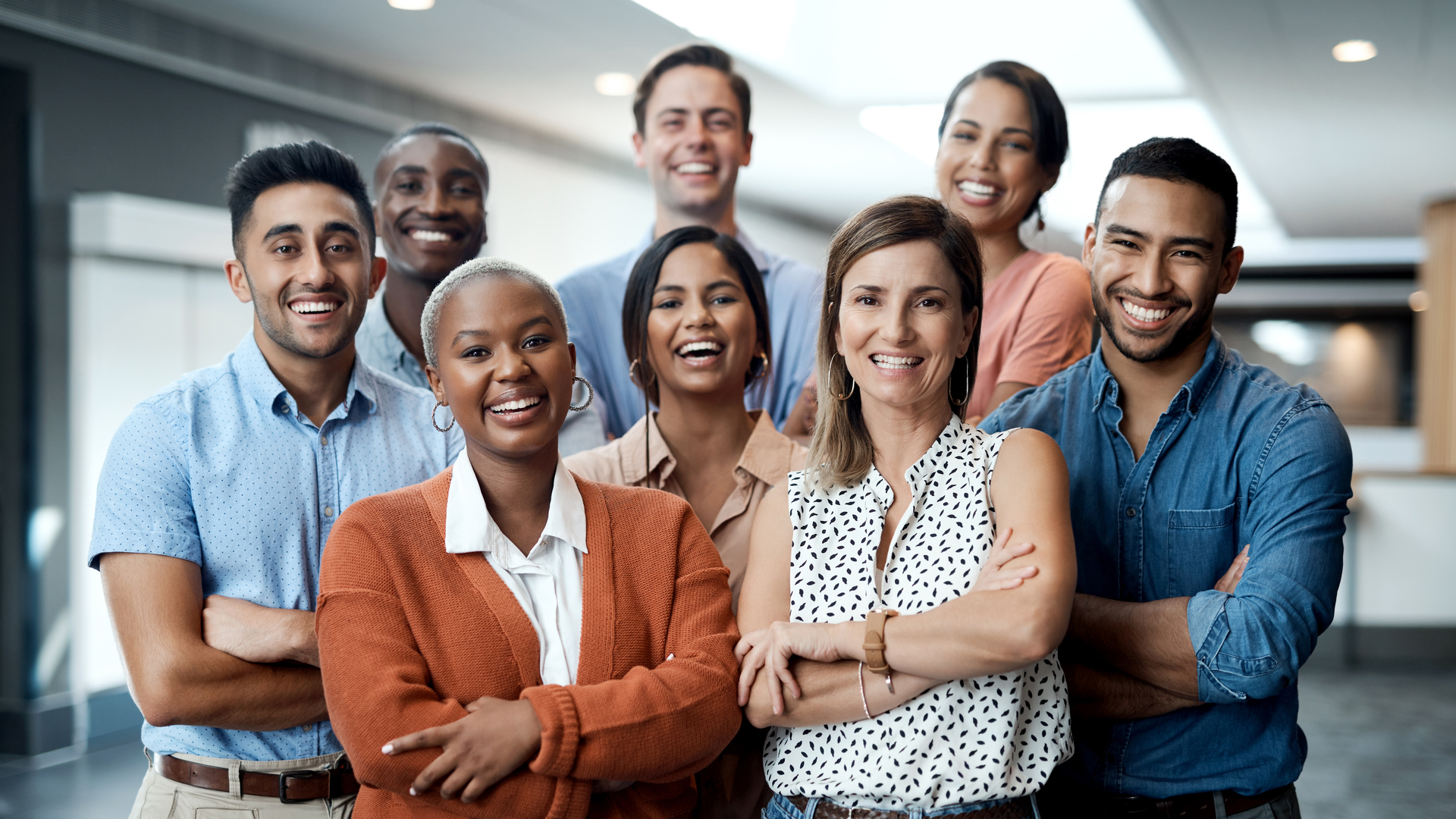 Portrait of a group of confident young businesspeople working together in a modern office