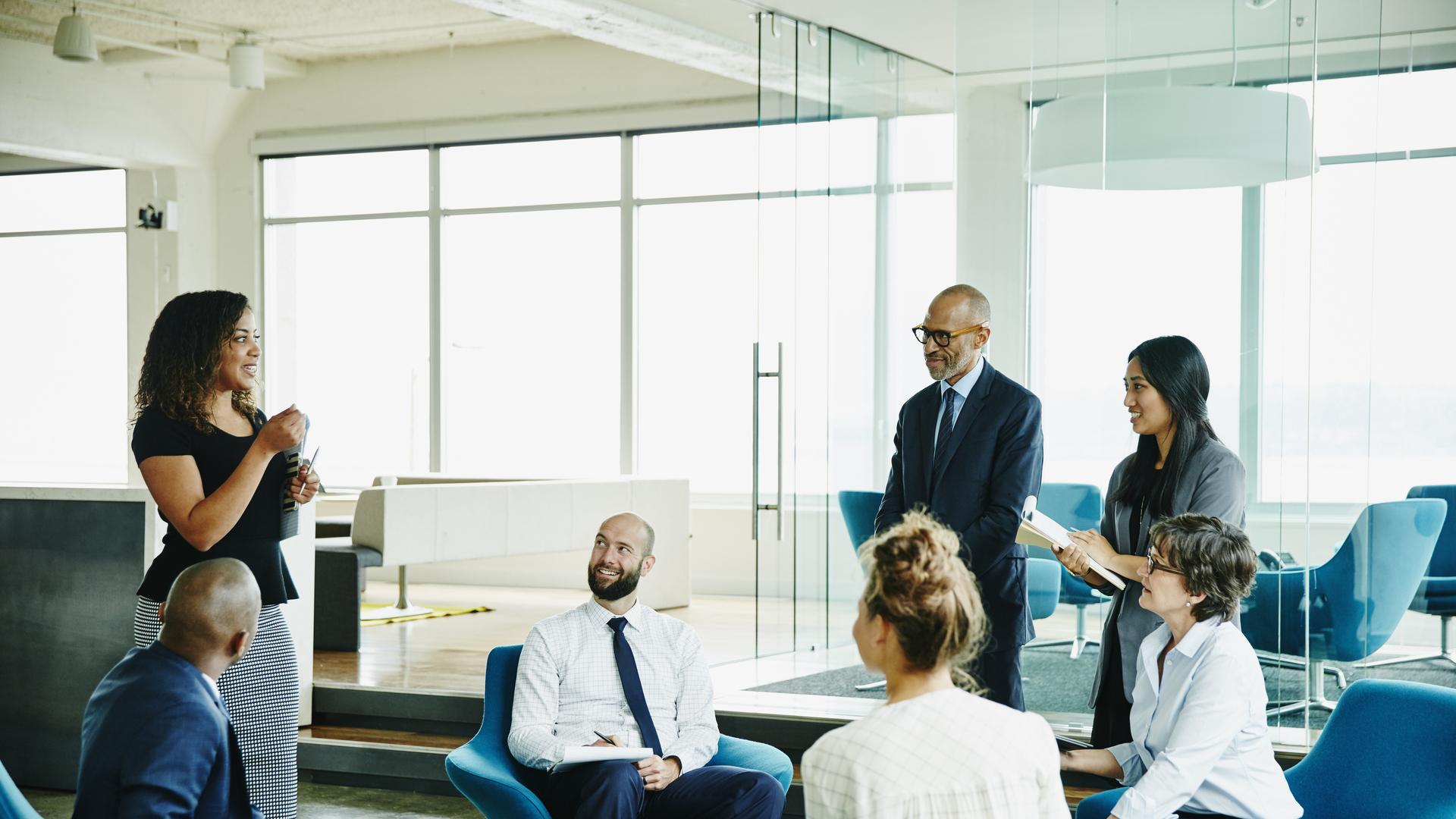 Businesswoman leading meeting with colleagues