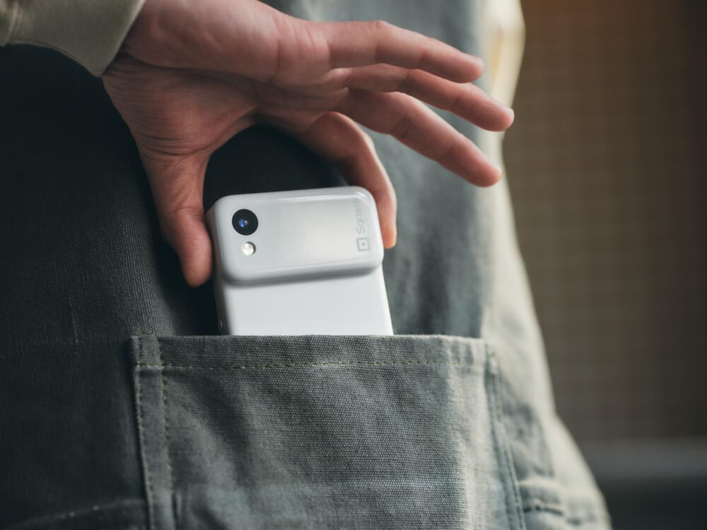 Square Handheld in the pocket of restaurant employee