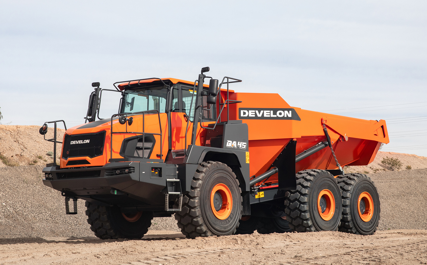 A DEVELON articulated dump truck parked on a job site.