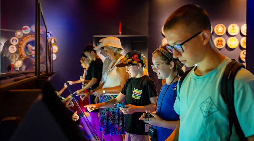 Grandparents and grandkids take in a museum exhibit in Washington D.C.