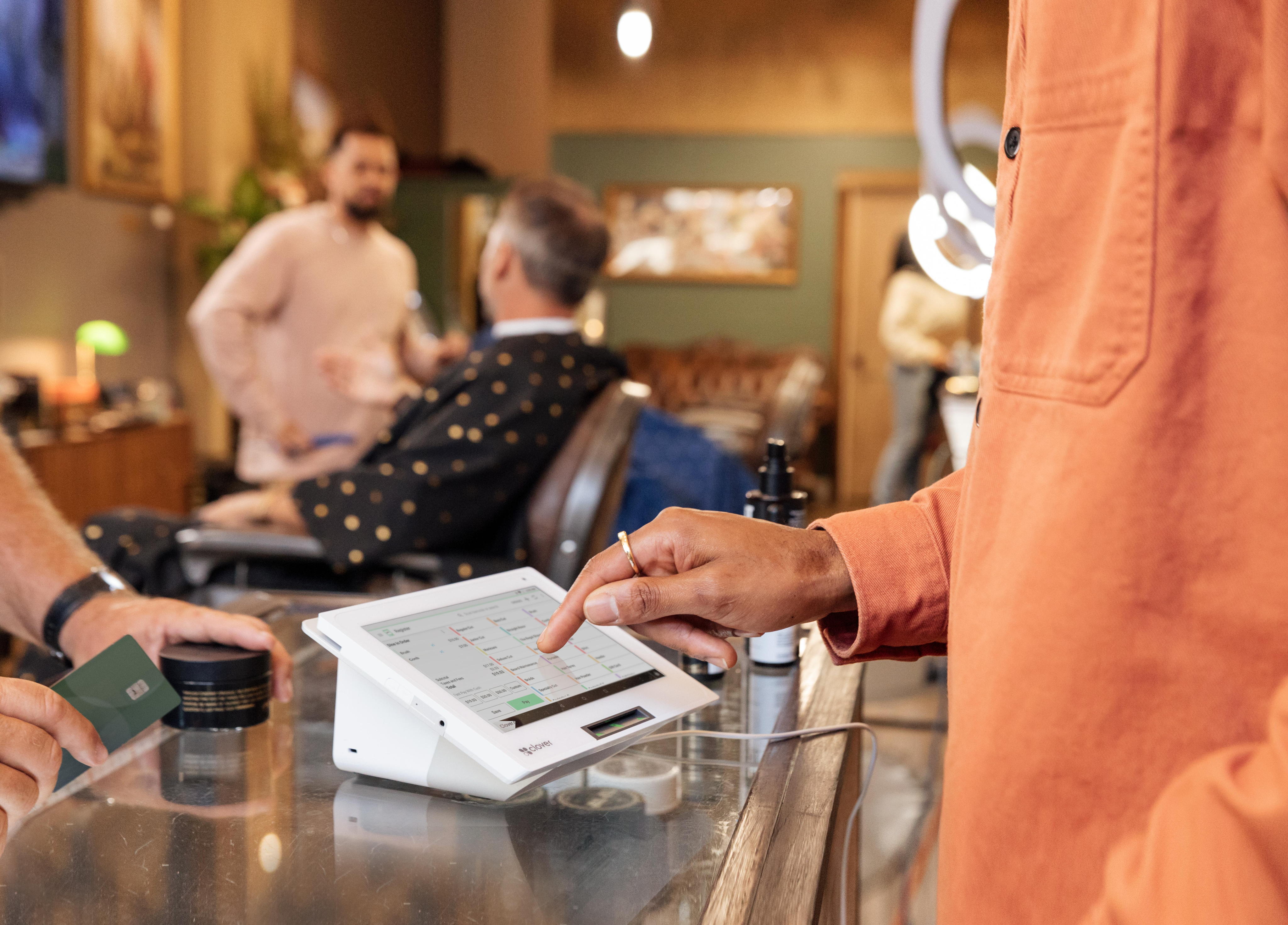 tapping payment terminal touchscreen to initiate transaction