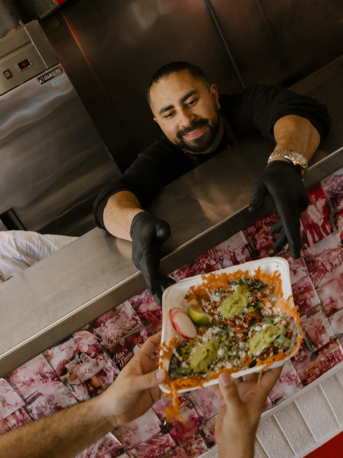 Villa's Tacos LA serving customers.webp