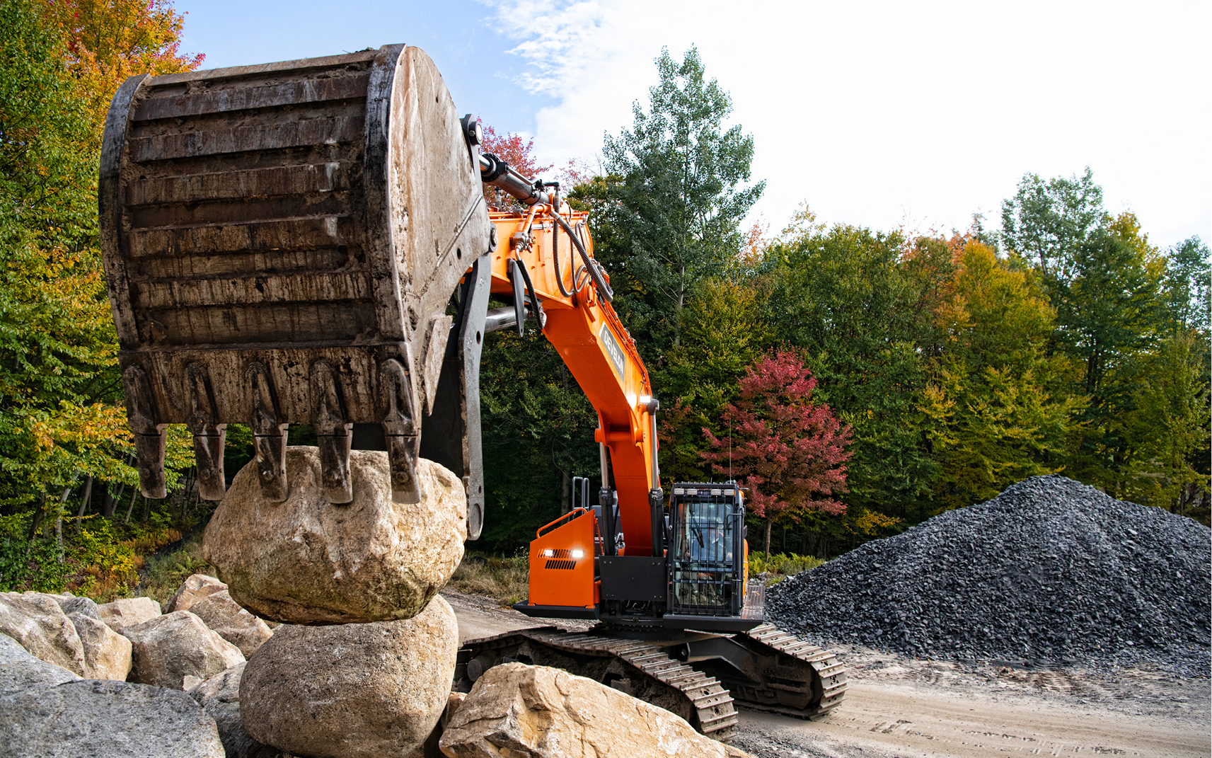 Photo of lineup of DEVELON excavators.