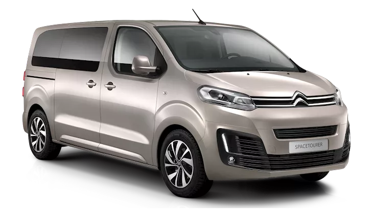 Front-side view of a beige Citroën SpaceTourer MPV, featuring a sleek design with sliding side doors and large windows, shown on a plain background.