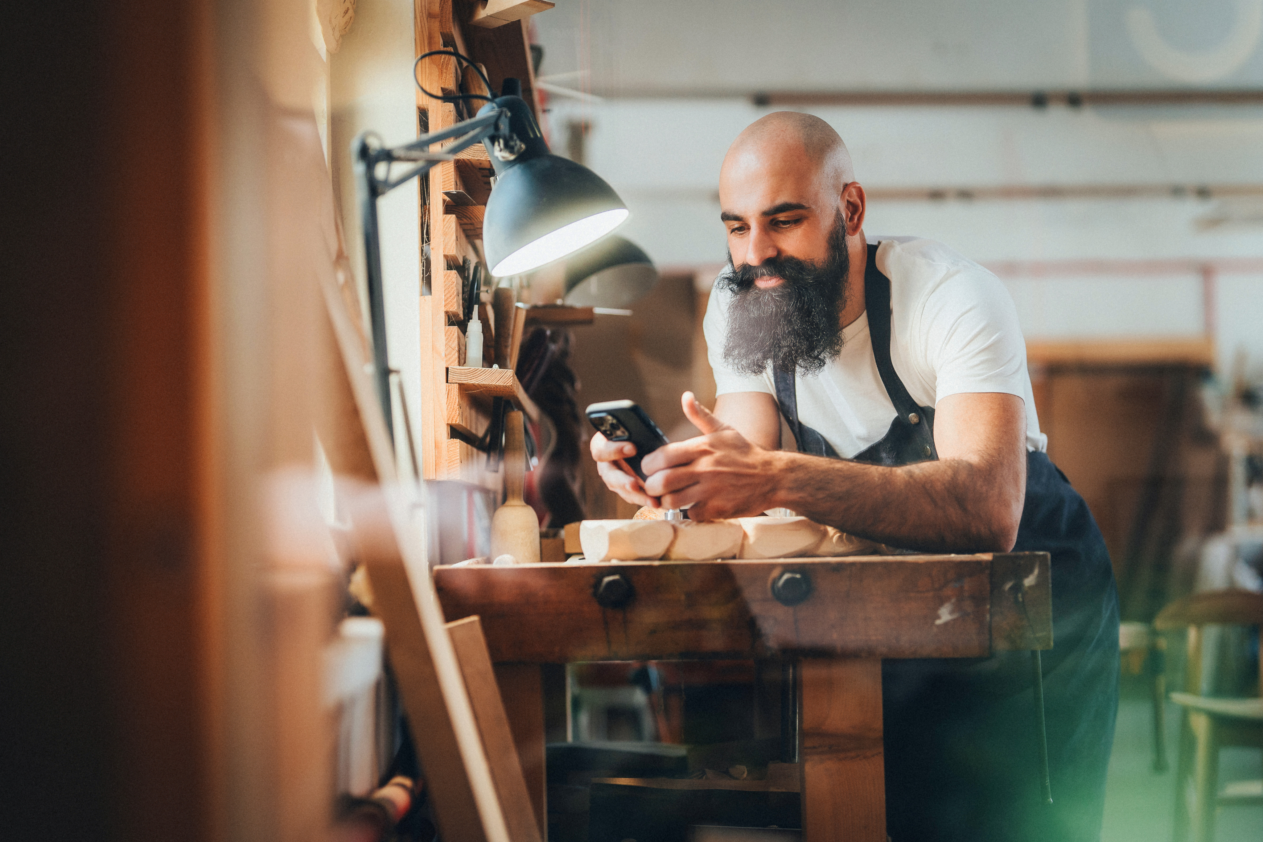 shop owner using phone