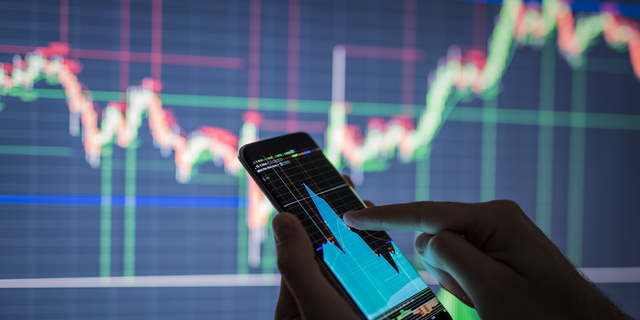 Businessman checking stock market data.