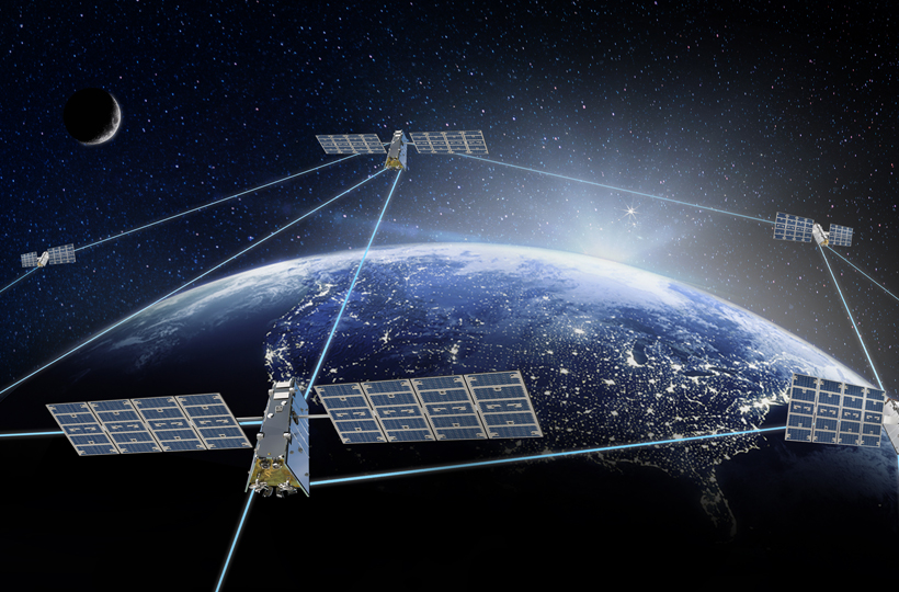 Image of connected satellites over world globe with lit up cities