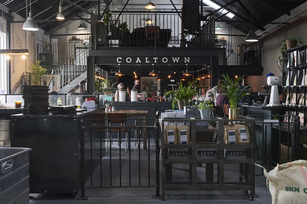 photo of Coaltown Coffee roastery showing the seating area and drinks bar