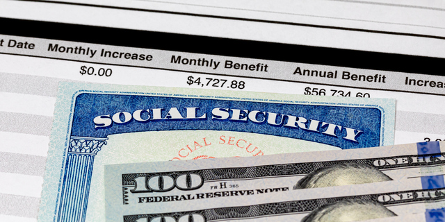 Social Security Card, benefits statement and 100 dollar bills. Social security funding, payment, retirement and federal government benefits concept