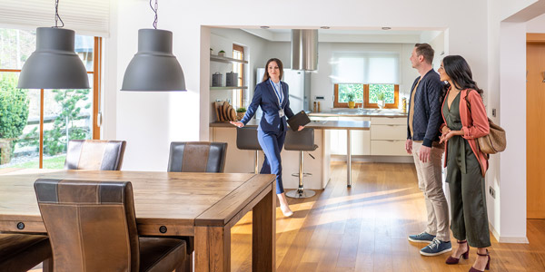 real estate agent showing a home to clients
