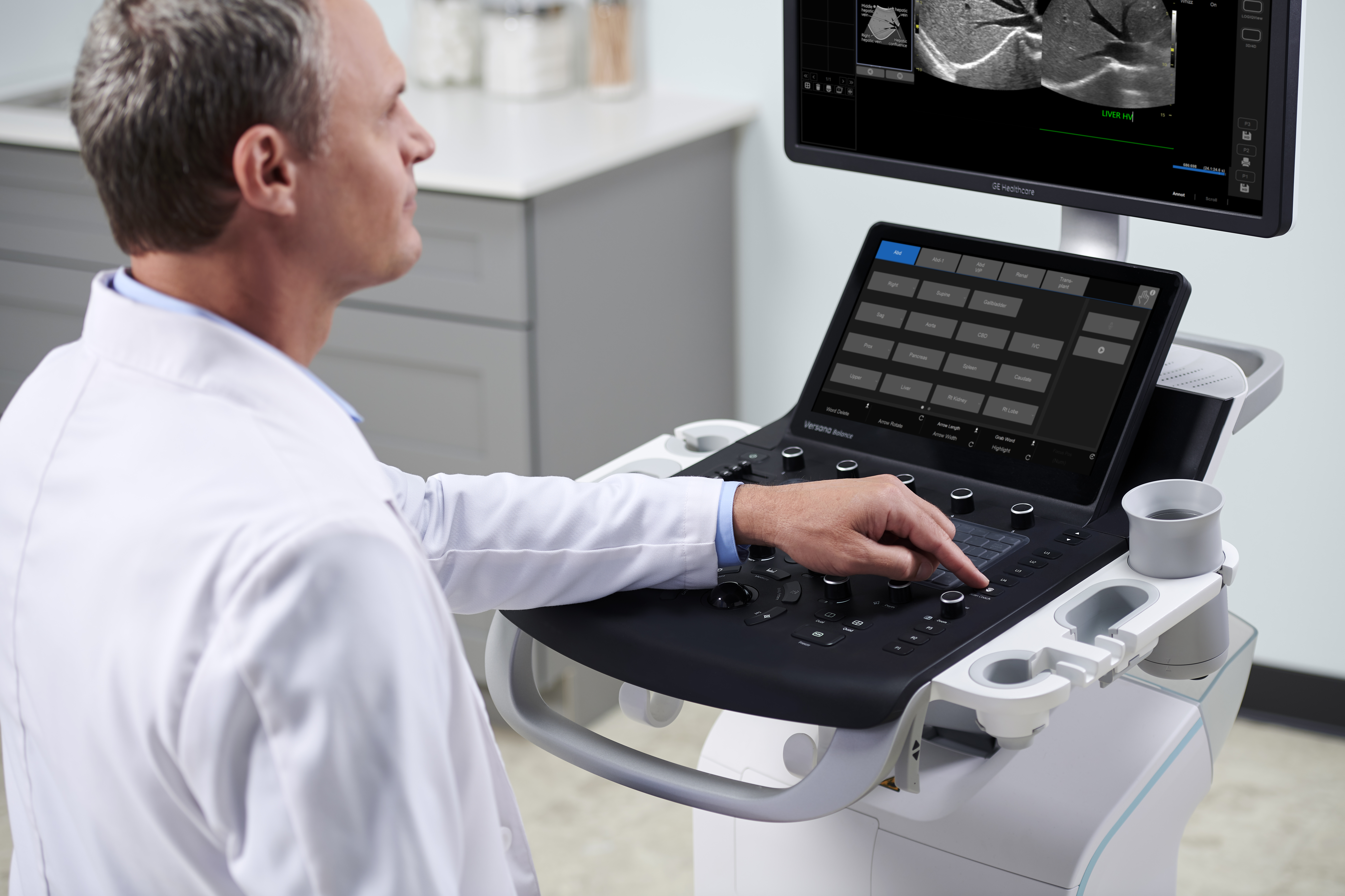 A physician works with an ultrasound system 