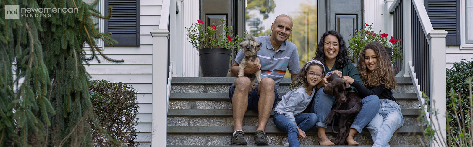 family sitting on the front stairs