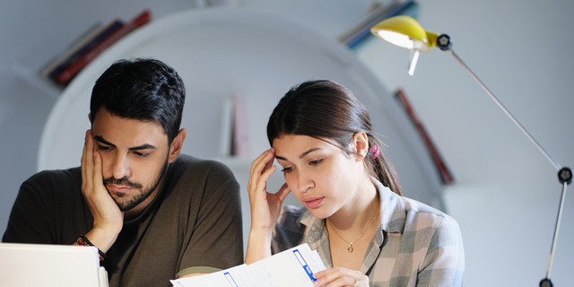 Man and Woman Worried For Taxes And Family Budget