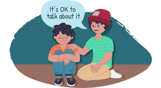 Illustration of two people sitting on the floor indoors. One person sits with knees drawn up while the other places a hand on their shoulder. A speech bubble reads, “It’s OK to talk about it”.
