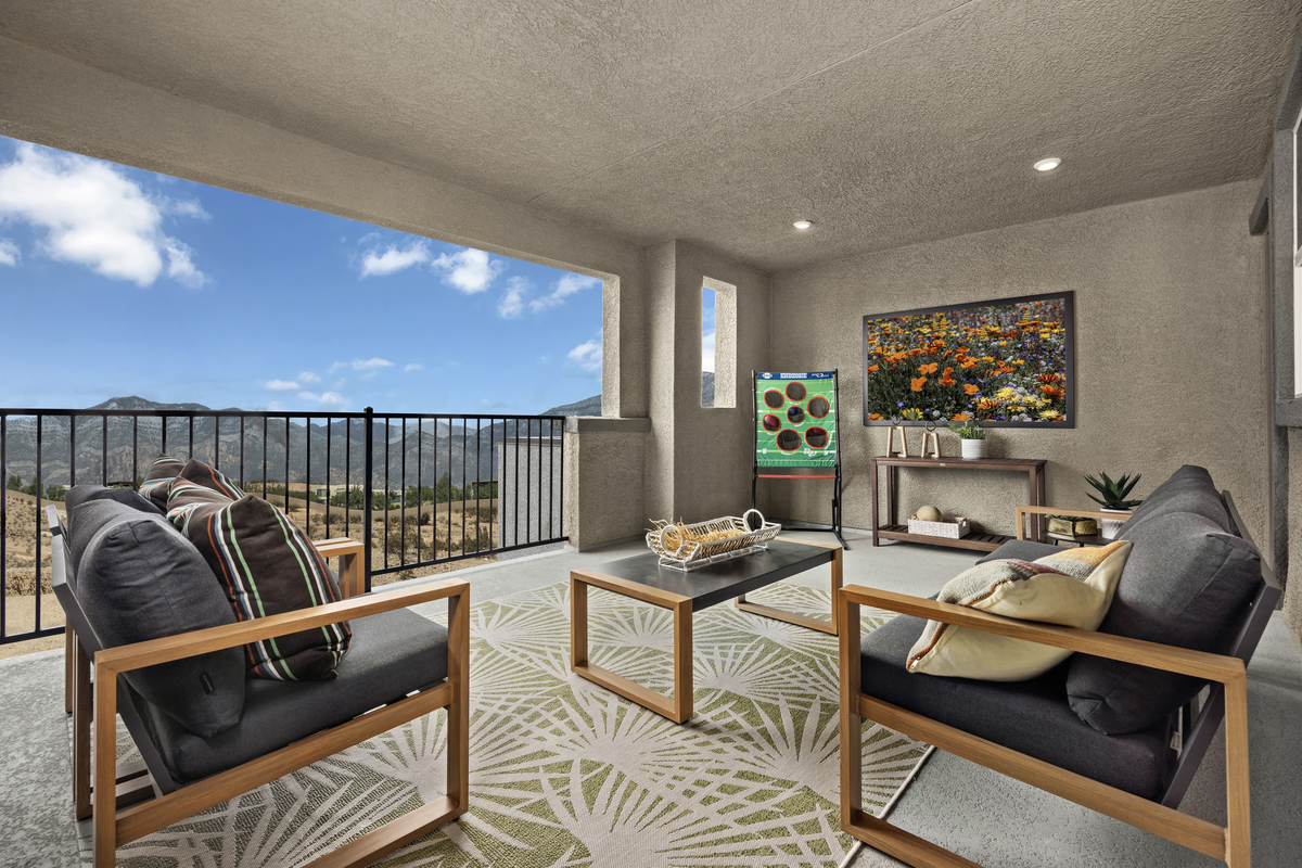 balcony with rug, table and two chairs